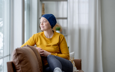 iStock image of a cancer patient smiling and looking out a window | Icon Cancer Centre